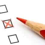 Red pencil and questionnaire